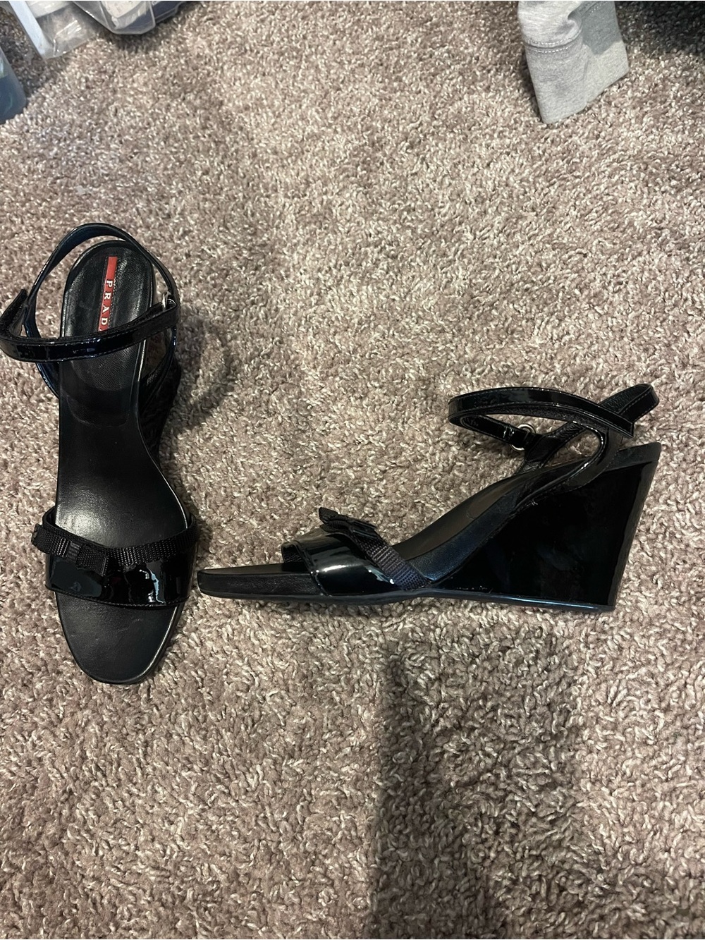 Prada patent black wedge sandals with bow detail